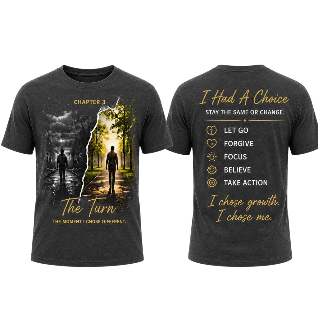 A dark charcoal gray graphic t-shirt shown from both the front and back. The front features a split design with a dark stormy landscape on the left and a bright sunlit path with two silhouetted figures on the right, captioned 'CHAPTER 3 The Turn'.